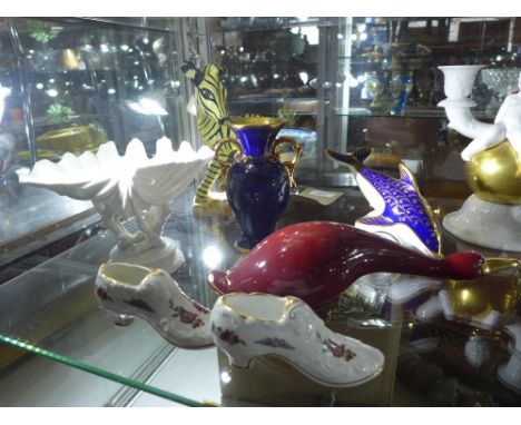 A collection of ceramics to include a Goldscheider zebra, a Rosenthal candelabra, a Royal Crown Derby dolphin, a limoges urn,