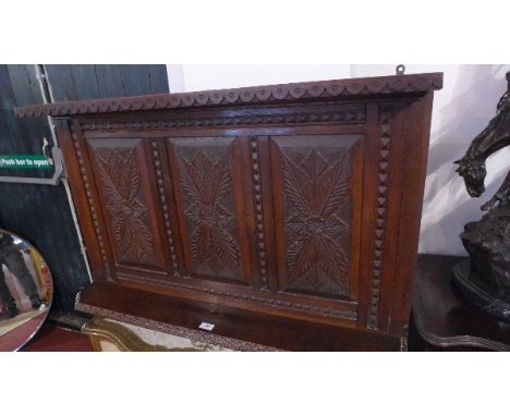 A 19th Century carved oak wall hanging shelf