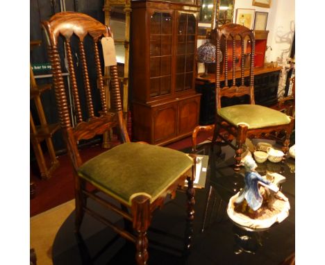 A pair of simulated rosewood bedroom chairs with bobbin supports.