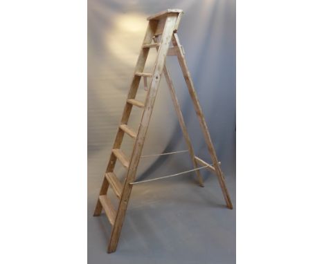 A white painted pine ladder.