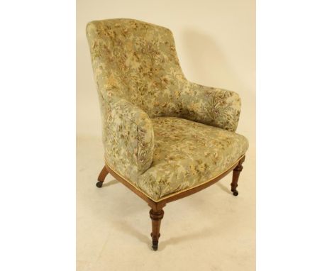 A LATE VICTORIAN MAHOGANY FRAMED BOUDOIR ARMCHAIR, of tub form with stringing, button upholstered in floral weave, bowed over