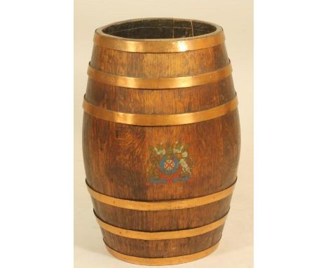 A COOPERED OAK STICK BARREL, early 20th century, the copper banded body with Royal Coat of Arms print, 13" x 24"