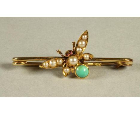 AN EDWARDIAN INSECT TIE PIN, the wings pave set with graduated split seed pearls, ruby cabochon eyes and turquoise body, unma