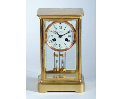 A BRASS CASED FOUR GLASS MANTEL CLOCK, the twin barrel movement with anchor escapement and exposed mercury pendulum, 3" white