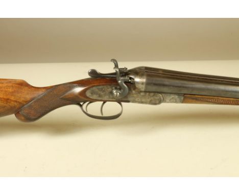 A WANLESS BROS SIDE BY SIDE 12BORE HAMMER SHOTGUN, with 30" barrels inscribed with the maker's name and address, blued sidelo