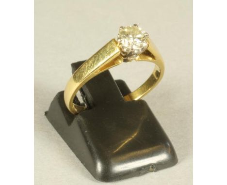 A SOLITAIRE DIAMOND RING, the brilliant cut stone of approximately 0.50cts claw set to a plain 18ct gold shank, size K