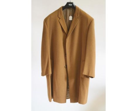 A GENTLEMAN'S VICUNA TOP COAT, mid 20th century, lined in brown satin, with three buttons to the top stitched placket front, 
