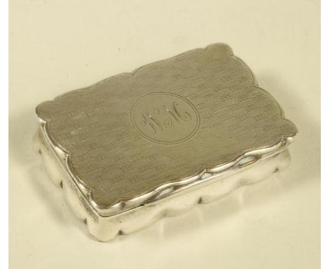 A SILVER SNUFF BOX, makers Stokes & Ireland Ltd., Chester 1914, of shaped oblong form with engine turned basket weave base an