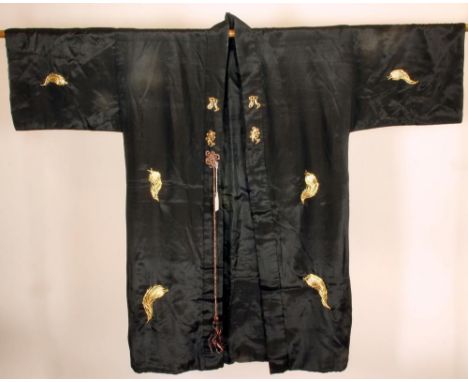 A JAPANESE BLACK SILK KIMONO, 20th century, the back richly embroidered in gold paper wrapped silk thread with a peacock in d