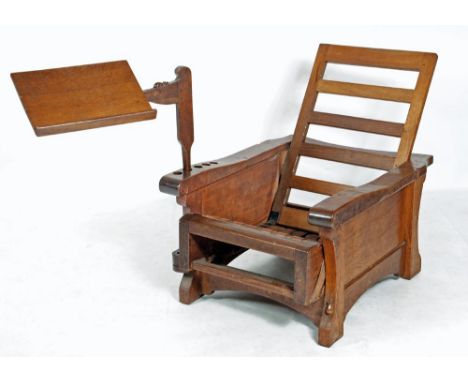 AN ADZED OAK RECLINING READING CHAIR BY ROBERT THOMPSON, c.1930's, with sliding ladder back and leather woven seat, loose cus