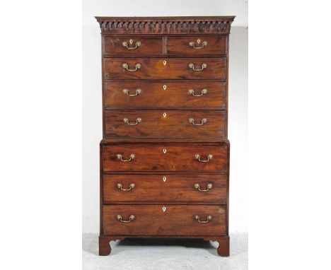 A GEORGE III MAHOGANY CHEST ON CHEST, late 18th century, the moulded and lambrequin cornice over two short and three long dra