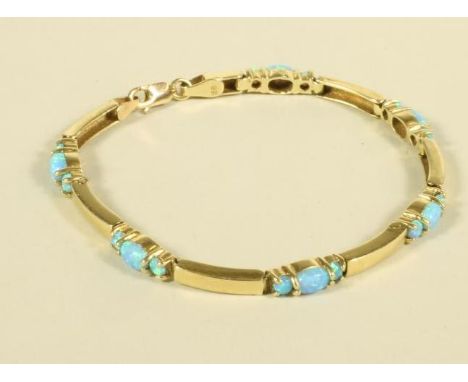 AN OPAL BRACELET, the six curved 14ct gold bars each interspersed with three claw set opals, 7 1/4" long