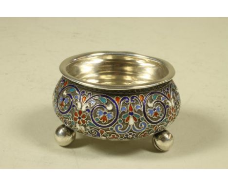 A RUSSIAN SILVER SALT, late 19th century, of rounded conical form on ball feet, with red, white and blue cloisonne enamel scr