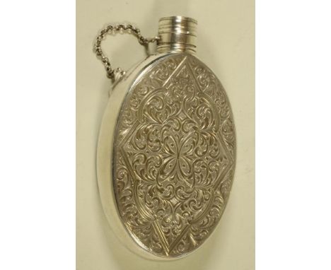 A MID VICTORIAN SILVER HIP FLASK, maker's mark RT, Birmingham 1868, of plain oval form, bright cut engraved with a panel of s