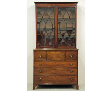 A GEORGIAN MAHOGANY SECRETAIRE BOOKCASE, c.1800, the moulded cornice and plain frieze over two astragal glazed doors enclosin