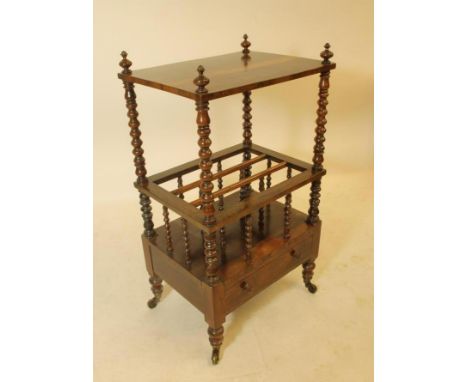 A VICTORIAN ROSEWOOD WHATNOT CANTERBURY of oblong form, the raised shelf on bobbin turned uprights with turned finials, simil