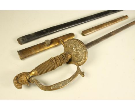 A VICTORIAN DRESS SWORD, the 31" blade etched with foliate scrolls, brass hilt with shell guard bearing an eagle, floral deco