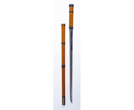 A JAPANESE KATANA SWORD STICK, with 24 ¾" blade, undulating hamon, button release, lacquered bamboo imitation cane and brass 