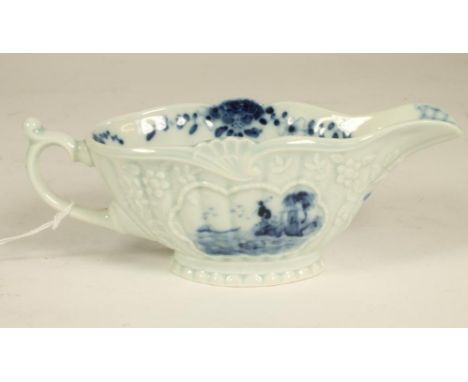 A SAMSON PORCELAIN SAUCEBOAT, late 19th century, in First Period Worcester style, of ribbed oval form with earred loop handle