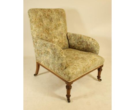 A LATE VICTORIAN MAHOGANY FRAMED ARMCHAIR with stringing and button upholstered in a floral weave, straight top rail, downcur