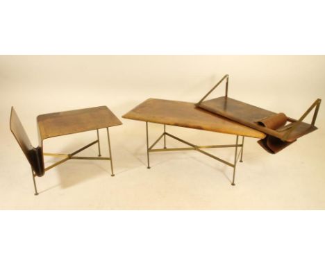 A LEATHER BOUND AND BRASS COFFEE TABLE in the manner of Jacques Adnet, c.1960, the stitched leather top of rounded oblong for