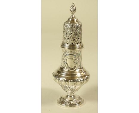 AN EDWARDIAN SILVER SUGAR CASTER, maker's mark HW, Sheffield 1903, of wrythen fluted baluster form, the lift off cover with f