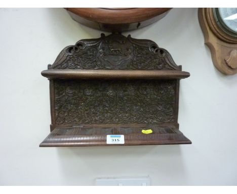 Indian carved wood pipe rack, pair brass candle holders and a barometer