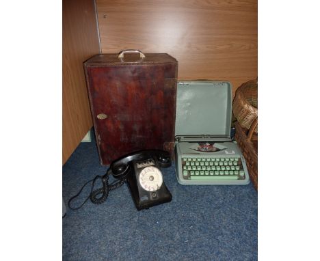 Vintage Hermes Baby typewriter, vintage telephone and a 1940s projector 