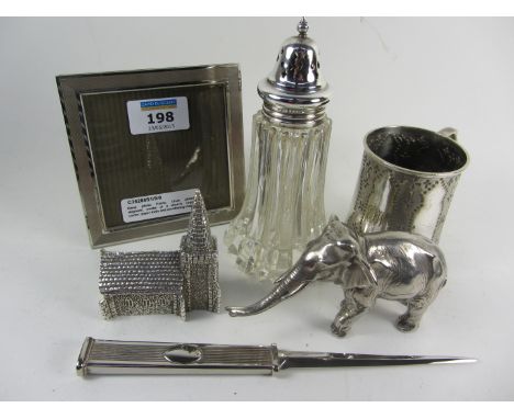 Silver-plated easel photo frame, model elephant, church, sugar castor, paper knife and christening mug