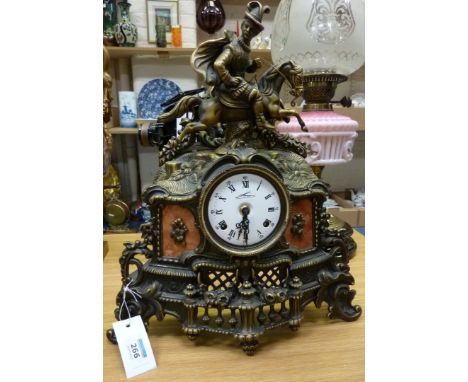 Cast brass mantle clock surmounted by equestrian figure, striking the half hour on two bells