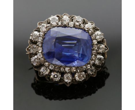 Late 19th C sapphire and diamond brooch, central mixed cut sapphire, estimated total weight carats 18.00 carats, set in a fra