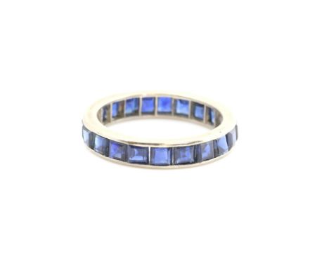 1930's full eternity ring, set with square cut sapphires, mount testing as 18 ct white gold, ring size K.     CONDITIONweight