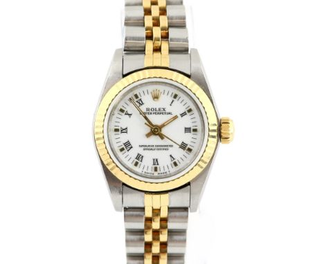 Rolex, A ladies oyster perpetual reference 67000 , the signed white enamel dial, with gold roman numerals , fitted with a cal