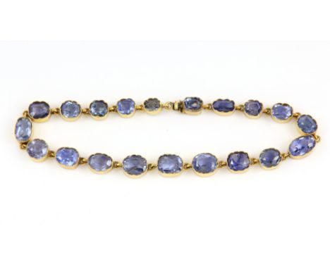 Vintage sapphire line bracelet, twenty oval cut sapphires, estimated total weight 16.33 carats, with concealed clasp, mount t