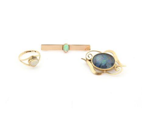 Three items of opal set jewellery, an opal set ring, and bar brooch and a black opal doublet openwork brooch, all in 9 ct gol