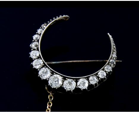 Victorian diamond crescent brooch, set with fifteen old cut diamonds, estimated total diamond weight 1.00 carat, mounted in s