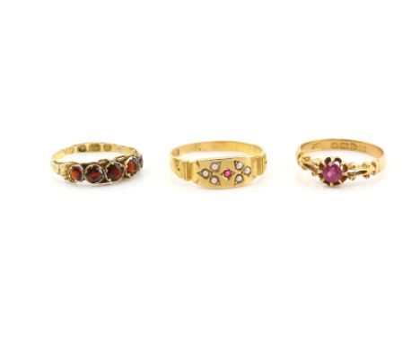Victorian gold ring set with seed pearls and small red paste stone in 18 ct gold, an antique garnet set ring in 12 ct,  and a