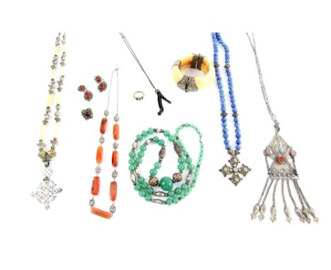 A group of ethnic Asian jewellery, lapis lazuli necklace boxed, another with mother of pearl, quartz and carnelian necklaces,
