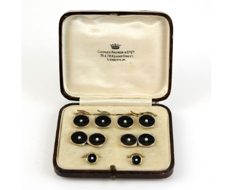 A cased set of Art Deco cufflinks and shirt studs, in gold with onyx and pearl, Circa 1930, backs stamped 9 ct, by Charles Pa