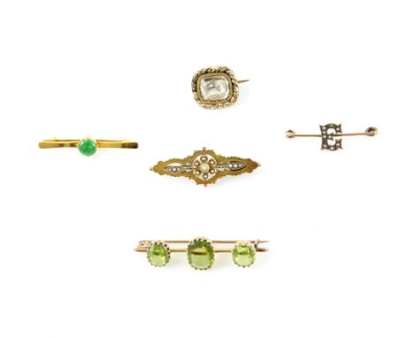 Five brooches, one set with Jade, another Edwardian seed pearl set, both mounts testing as 18 ct, oval cut three stone perido