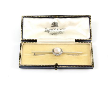 Edwardian brooch set with large pearl  within a border of milgrain set diamonds, mount platinum and 18 ct, boxed by Sharman D