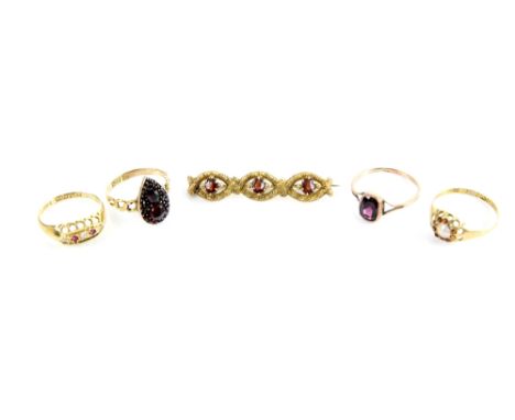 A group of antique garnet set jewellery, four rings variously set with garnet, diamond, pearl, and a garnet set brooch .     