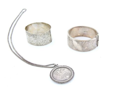 Two oval vintage silver bangles, one hallmarked Chester 1958 and the other hallmarked Birmingham 1937, with  coin mount and f