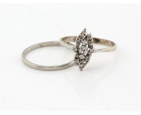 Vintage diamond set ring with central stone and surrounding leaf setting, mount testing as silver, ring size P and a platinum