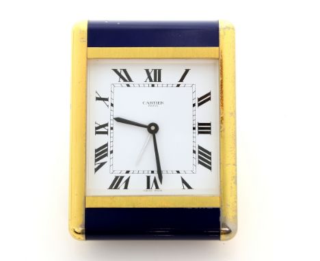 A Cartier gold plated and blue enamelled alarm desk clock, the signed dial with roman numerals and inner minute track, caboch