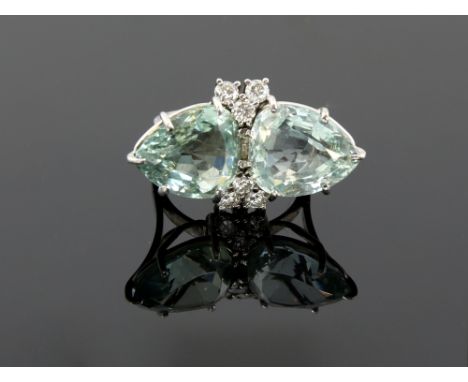 Vintage dress ring, set with two pear cut aquamarines, estimated total weight 12.53 carats, and six round brilliant cut diamo