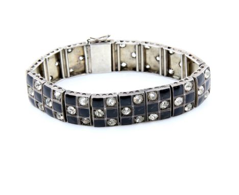 1930's bracelet, set with  black enamel squares and white round cut paste stones, in checker board motif, 17cm in length, con