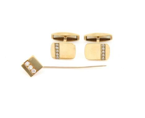 A pair of gold cufflinks, rectangular panel with rounded corners, each set with five round brilliant cut diamonds, hallmarked