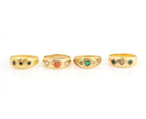 Four antique gem set gypsy rings, two with emerald and diamond  another coral and pearl and a garnet set ring, all set in 18 