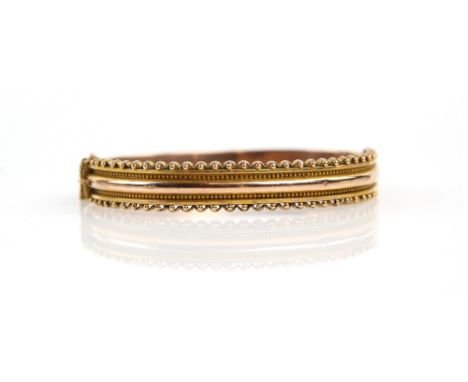 Edwardian wirework bangle, hallmarked Birmingham 1910, makers mark S &amp; P, with concealed clasp and safety chain, in 9 ct 